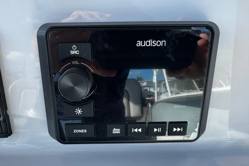 Slide: The Image of Audio control panel on 2026 Sea Pro 242 Center Console boat. - 23