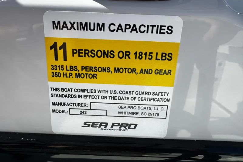 Slide: The Image of 2026 Sea Pro 242 Center Console capacity label, 11 persons or 1815 lbs, 350 HP motor. - 39