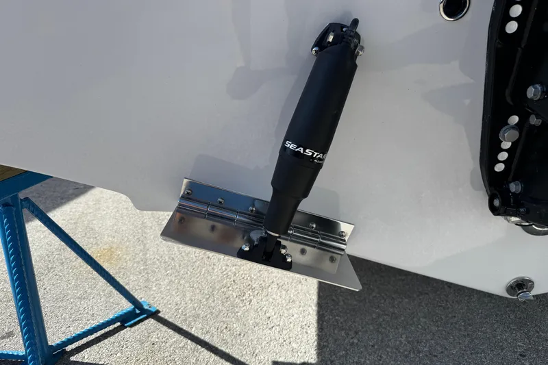 Slide: The Image of Trim tab and hydraulic actuator on 2026 Sea Pro 242 Center Console boat. - 4