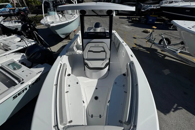 Slide: The Image of 2026 Sea Pro 242 Center Console boat displayed in a marina setting. - 45