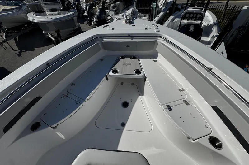 Slide: The Image of 2026 Sea Pro 242 Center Console boat interior with seating and storage compartments. - 48