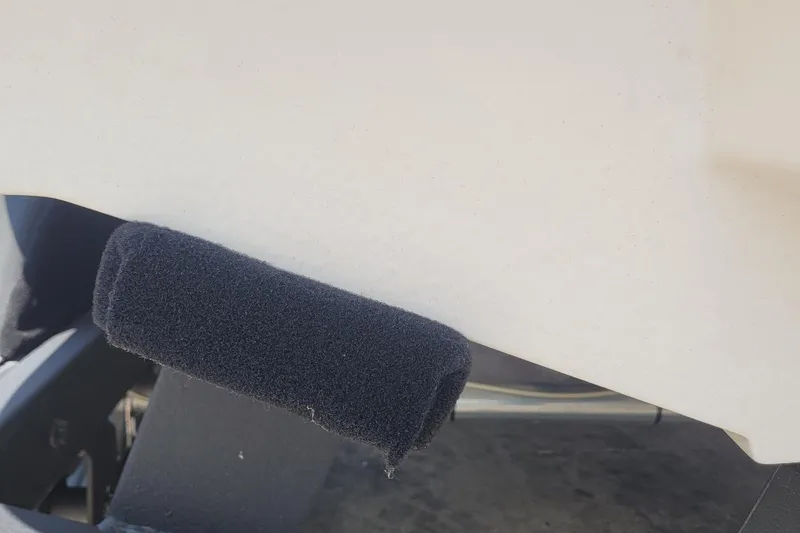 Slide: The Image of Close-up of a 2024 Tahoe 1950 boat with a black foam bumper. - 11