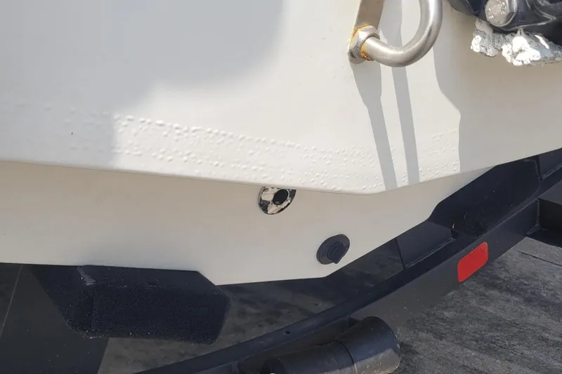 Slide: The Image of Close-up of a 2024 Tahoe 1950 boat's hull and trailer detail. - 3