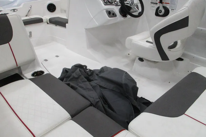 Slide: The Image of Interior of 2024 Tahoe 1950 boat with white and gray seating. - 7