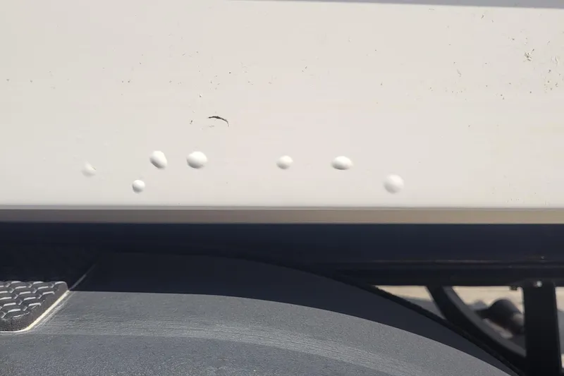 Slide: The Image of Close-up of 2024 Tahoe 1950 vehicle with paint imperfections on the body. - 8