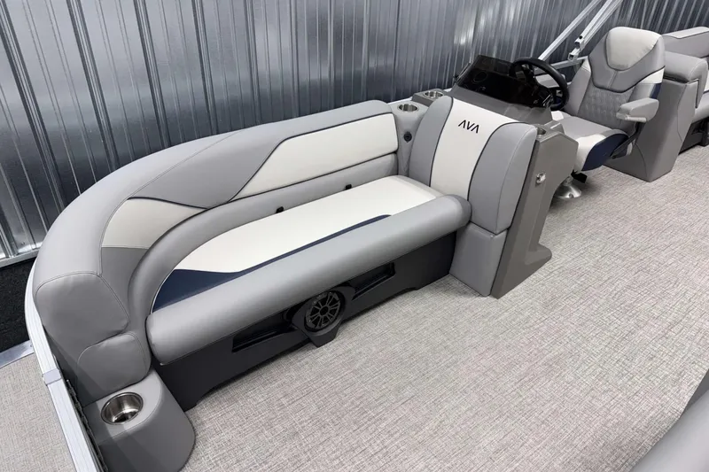 Slide: The Image of 2026 Avalon Venture 2385 QL pontoon boat interior with plush seating and modern helm. - 11