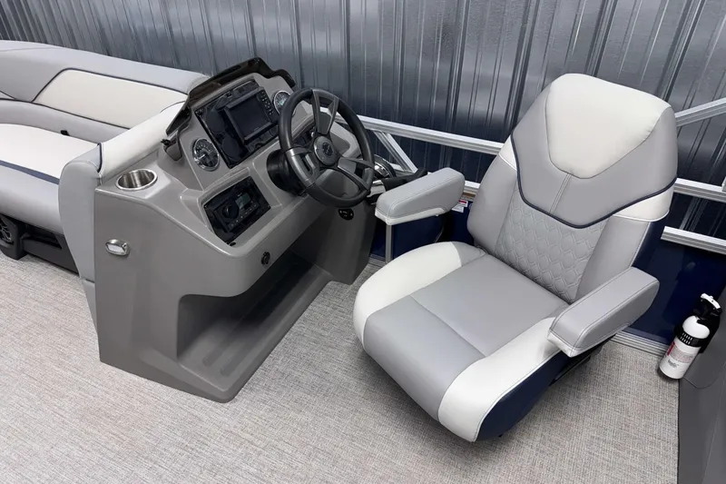 Slide: The Image of 2026 Avalon Venture 2385 QL boat interior with modern helm and luxurious seating. - 14