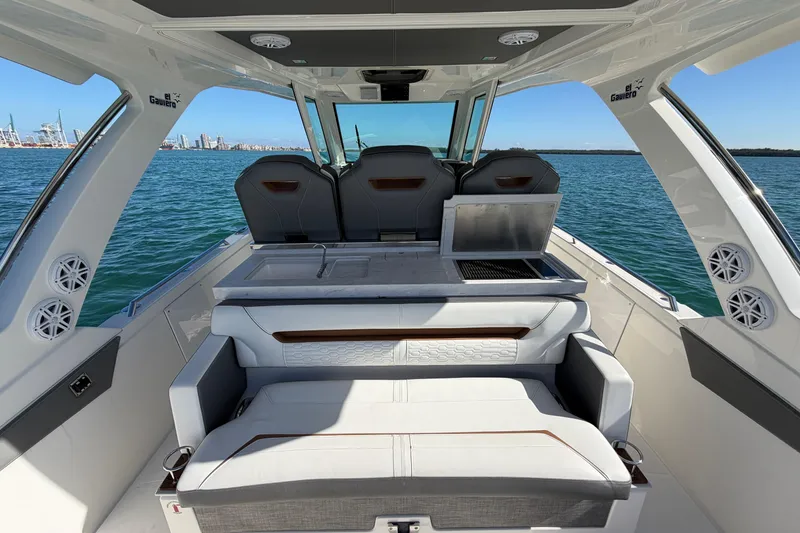 Slide: The Image of 2022 Tiara Yachts 34 LS interior with seating and ocean view. - 15