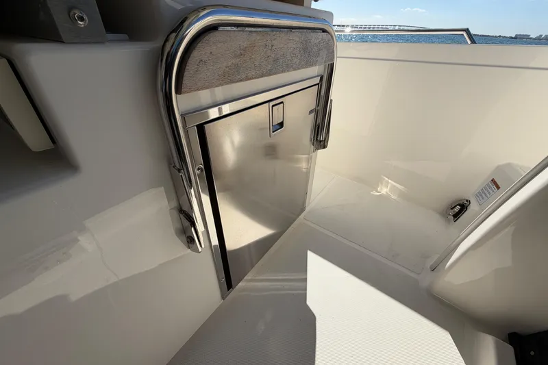 Slide: The Image of 2022 Tiara Yachts 34 LS interior detail with stainless steel storage compartment. - 28