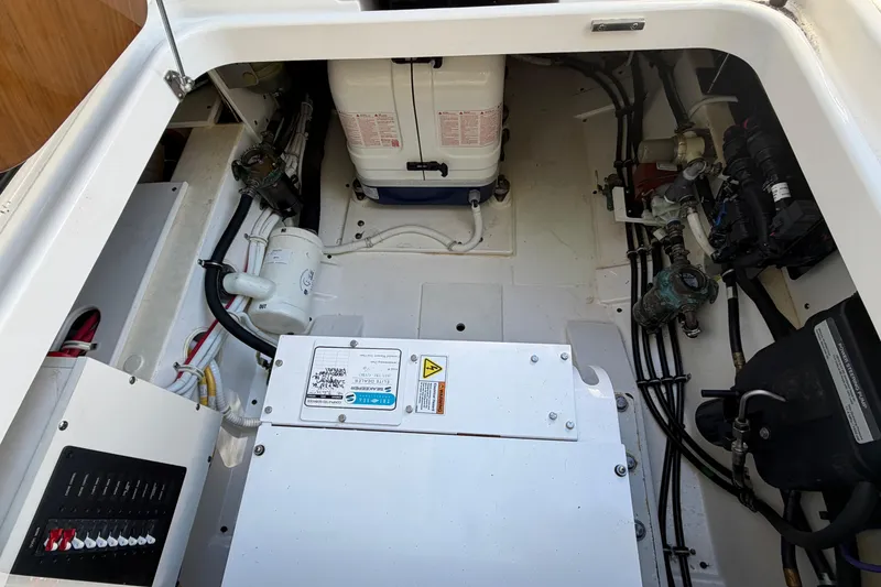 Slide: The Image of Engine compartment of 2022 Tiara Yachts 34 LS, showcasing mechanical components and wiring. - 31