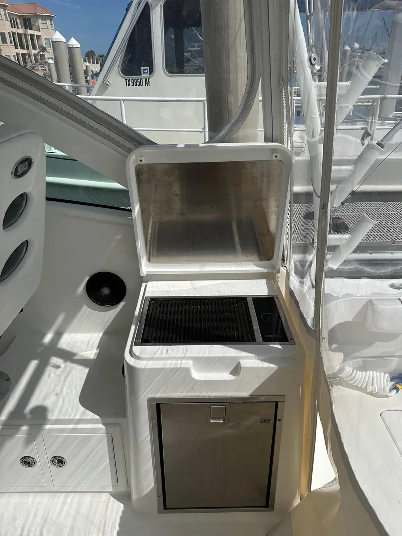 Slide: The Image of 2017 Albemarle Express boat interior with open storage compartment and sleek design. - 10
