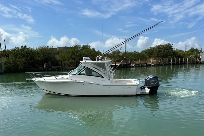 Slide: The Image of 2017 Albemarle Express boat on calm water under a clear blue sky. - 2