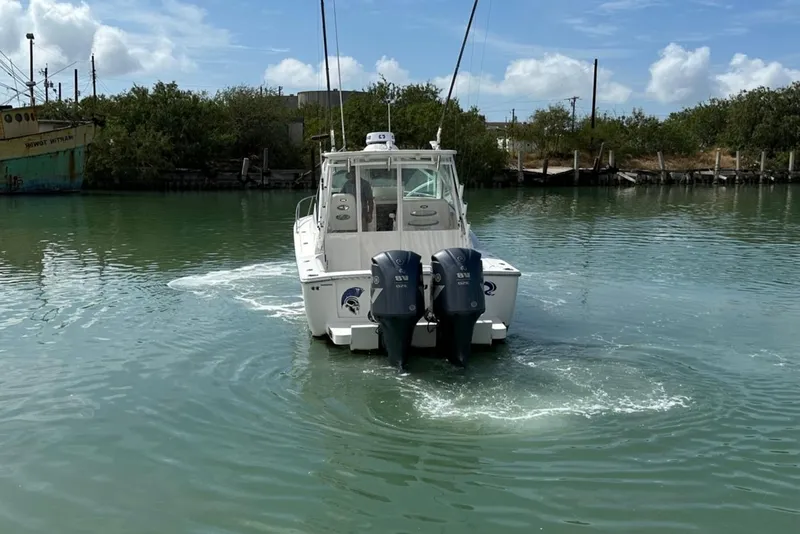 Slide: The Image of 2017 Albemarle Express boat with dual engines on calm water. - 3