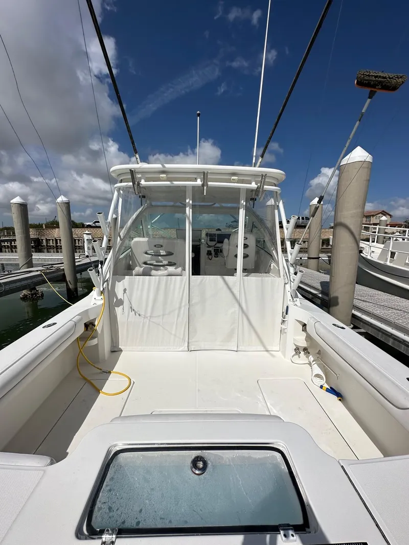 Slide: The Image of 2017 Albemarle Express boat docked at marina under clear blue sky. - 5