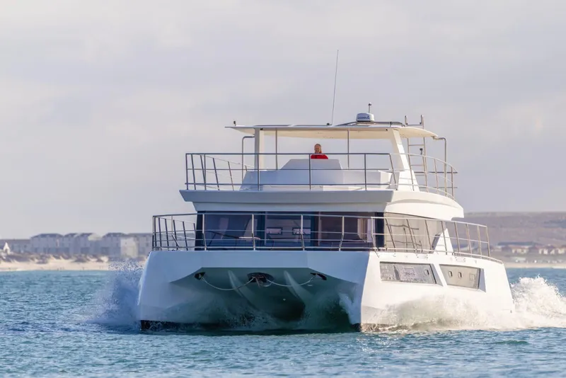 Slide: The Image of Luxurious interior of 2024 Leeuwin 55 yacht with comfortable seating and ocean view. - 17