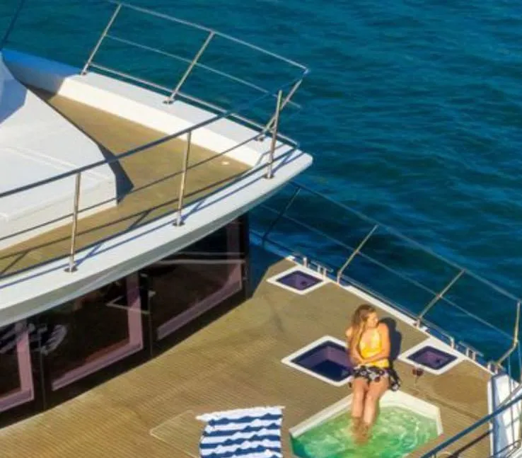 Slide: The Image of Luxurious interior of 2024 Leeuwin 55 yacht with modern gray seating and table. - 19