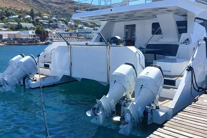 Slide: The Image of Luxury 2024 Leeuwin 55 yacht docked, featuring powerful outboard motors. - 33