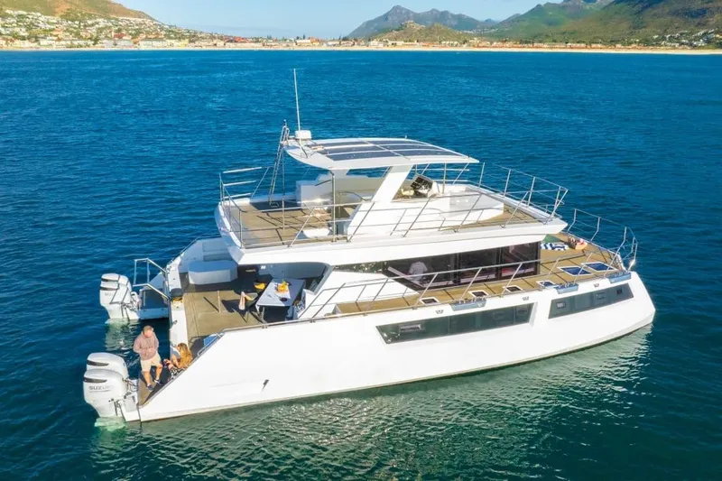 Slide: The Image of Luxurious 2024 Leeuwin 55 yacht cruising in scenic coastal waters. - 35