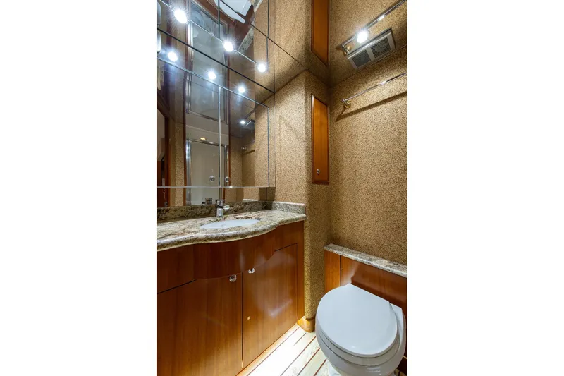 Slide: The Image of Luxurious bathroom in 2006 Hatteras 64 Convertible yacht with granite countertops. - 12