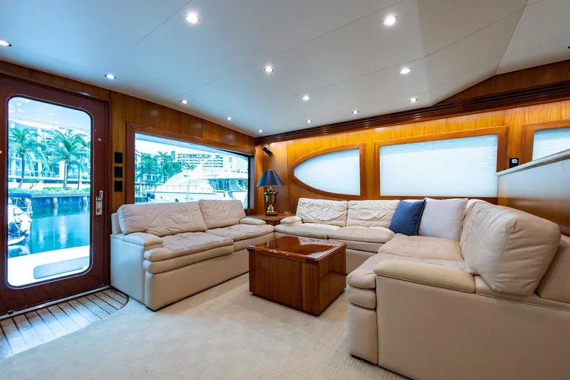 Slide: The Image of Luxurious interior of 2006 Hatteras 64 Convertible yacht with plush seating and elegant decor. - 2