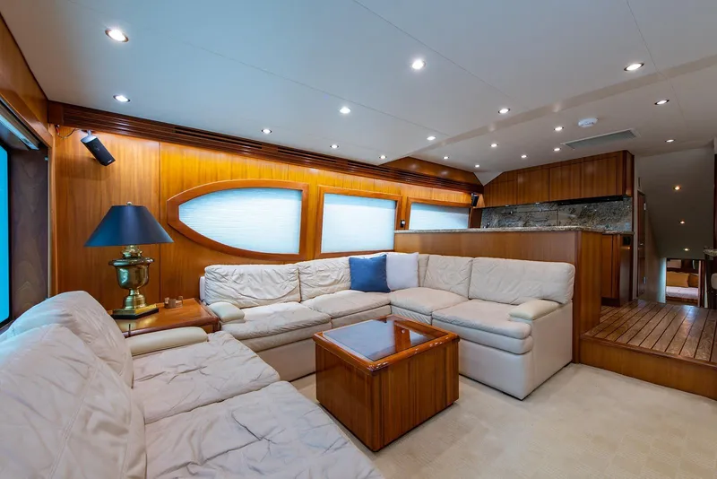 Slide: The Image of Luxurious interior of 2006 Hatteras 64 Convertible yacht with plush seating and elegant wood finishes. - 3