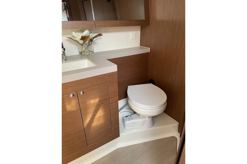 Slide: The Image of Luxurious bathroom in 2024 Beneteau Oceanis 51.1 yacht with modern fixtures and wood cabinetry. - 11