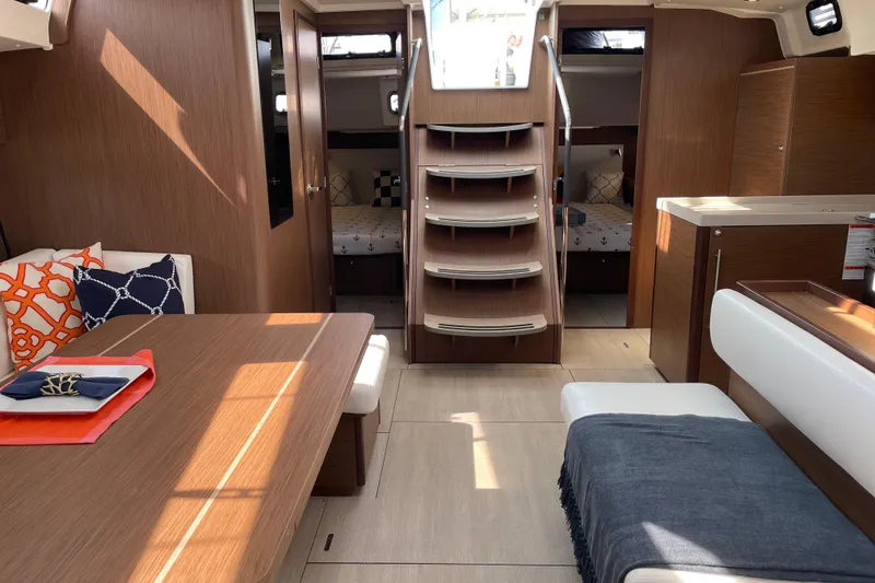 Slide: The Image of Luxurious interior of 2024 Beneteau Oceanis 51.1 yacht with modern wood finish. - 3