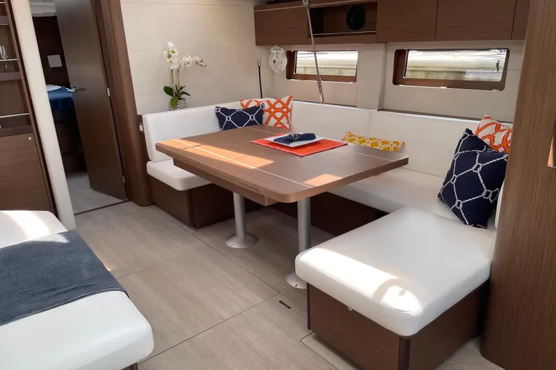 Slide: The Image of Luxurious interior of 2024 Beneteau Oceanis 51.1 yacht with elegant dining area. - 6