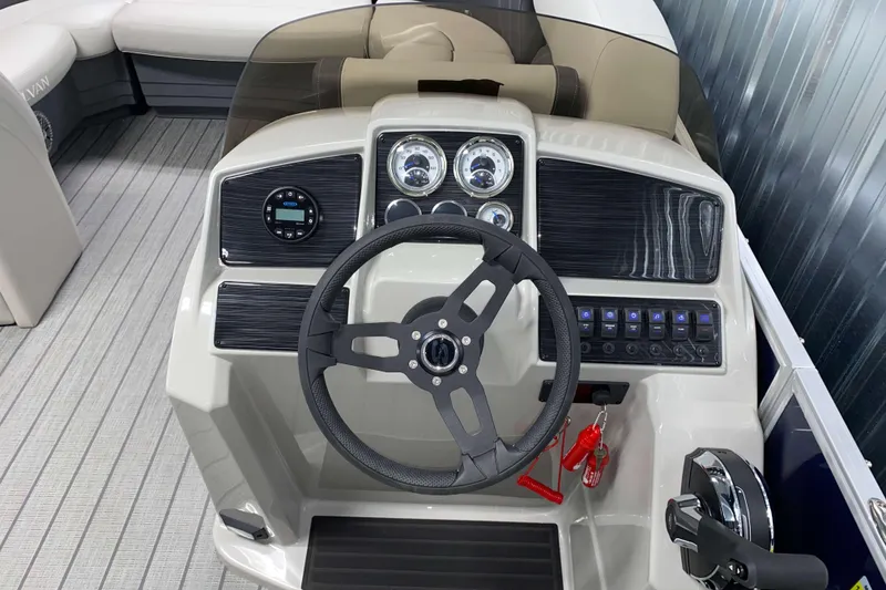 Slide: The Image of 2026 Sylvan Mirage 8522 LZ boat dashboard with steering wheel and control panel. - 10