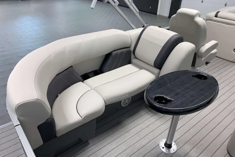 Slide: The Image of Luxurious seating on 2026 Sylvan Mirage 8522 LZ pontoon boat with sleek table design. - 11