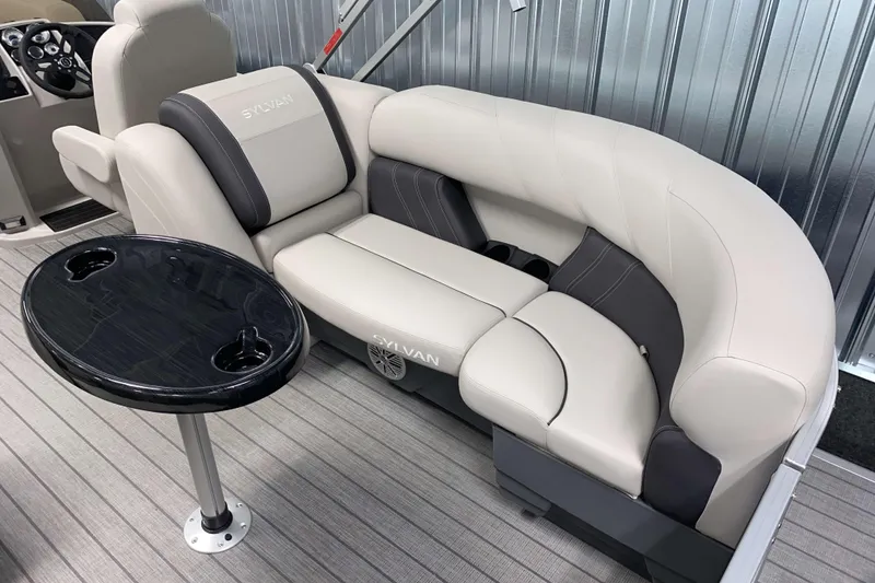 Slide: The Image of Luxurious seating in 2026 Sylvan Mirage 8522 LZ pontoon boat with table and cup holders. - 12