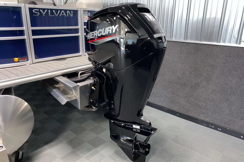 Slide: The Image of 2026 Sylvan Mirage 8522 LZ with Mercury outboard motor in showroom. - 19