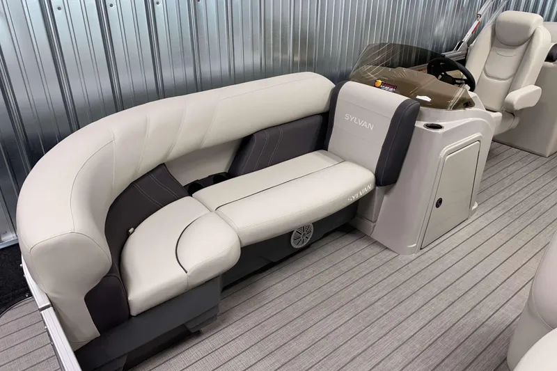 Slide: The Image of 2026 Sylvan Mirage 8522 LZ boat interior with plush seating and modern helm. - 4