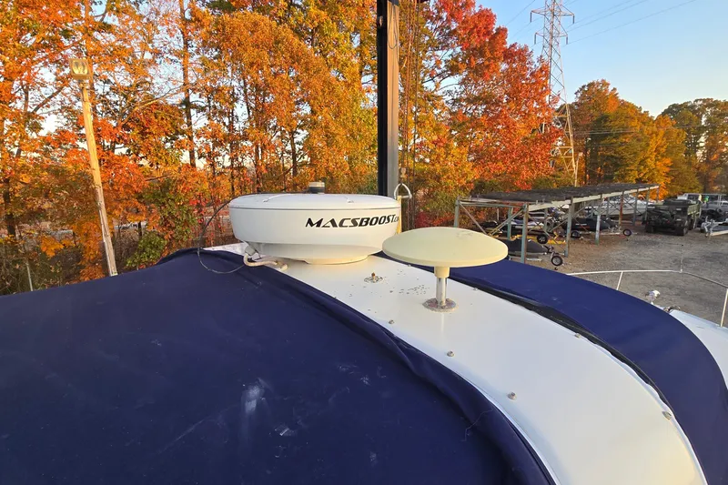 Slide: The Image of 2001 Sea Ray 310 Sundancer boat with autumn foliage background. - 16