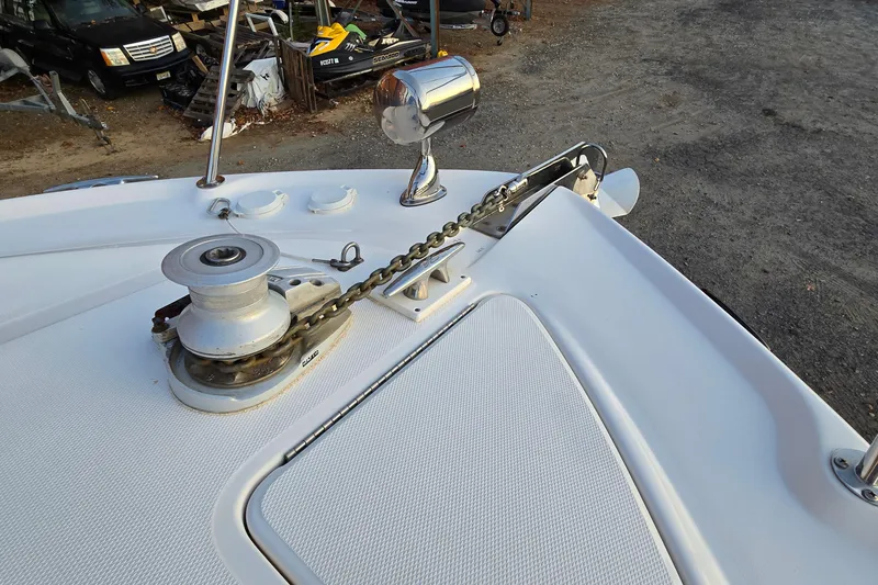 Slide: The Image of Bow of 2001 Sea Ray 310 Sundancer with anchor chain and winch. - 23