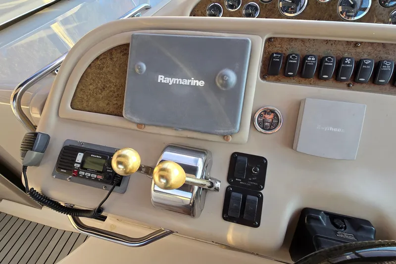 Slide: The Image of Control panel of a 2001 Sea Ray 310 Sundancer boat with Raymarine equipment. - 39