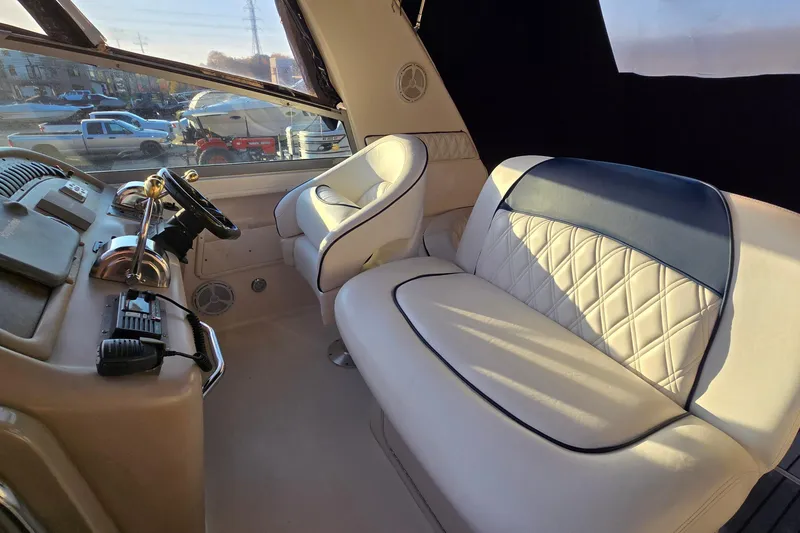 Slide: The Image of Interior of 2001 Sea Ray 310 Sundancer boat with luxurious seating and helm. - 40