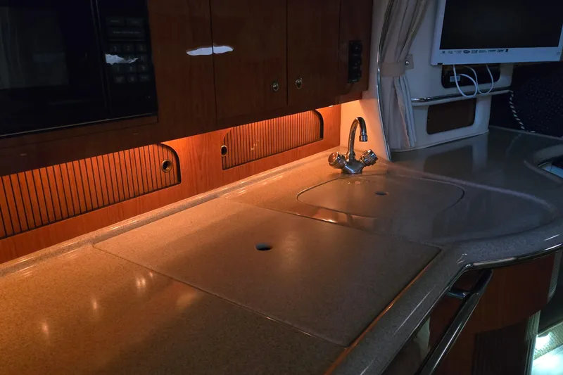 Slide: The Image of Luxurious kitchen area in a 2001 Sea Ray 310 Sundancer yacht. - 65