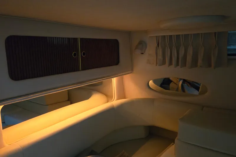 Slide: The Image of Interior of 2001 Sea Ray 310 Sundancer yacht with cozy seating and ambient lighting. - 67