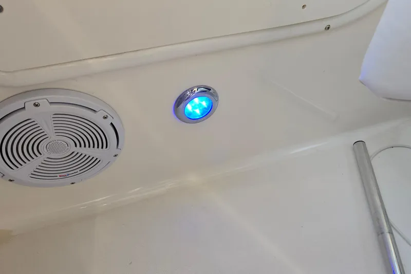 Slide: The Image of Speaker and blue LED light on 2001 Sea Ray 310 Sundancer boat interior. - 69