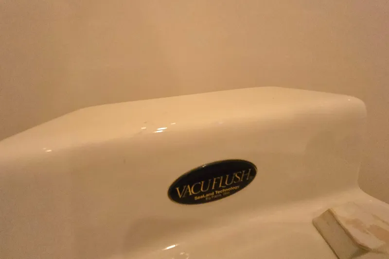 Slide: The Image of Vacuflush toilet system on 2001 Sea Ray 310 Sundancer boat. - 76