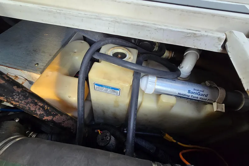 Slide: The Image of Engine compartment of a 2001 Sea Ray 310 Sundancer with SaniGard holding tank vent filter. - 77