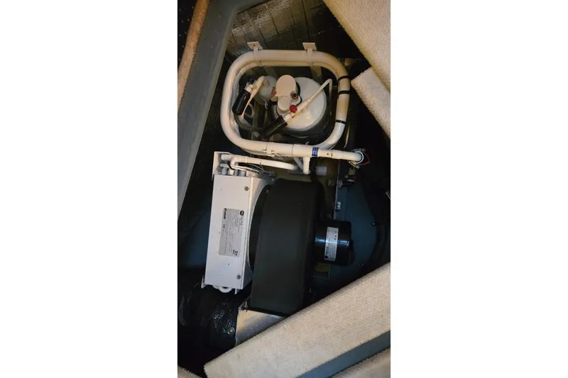 Slide: The Image of Engine compartment of 2001 Sea Ray 310 Sundancer boat, showcasing mechanical components. - 80