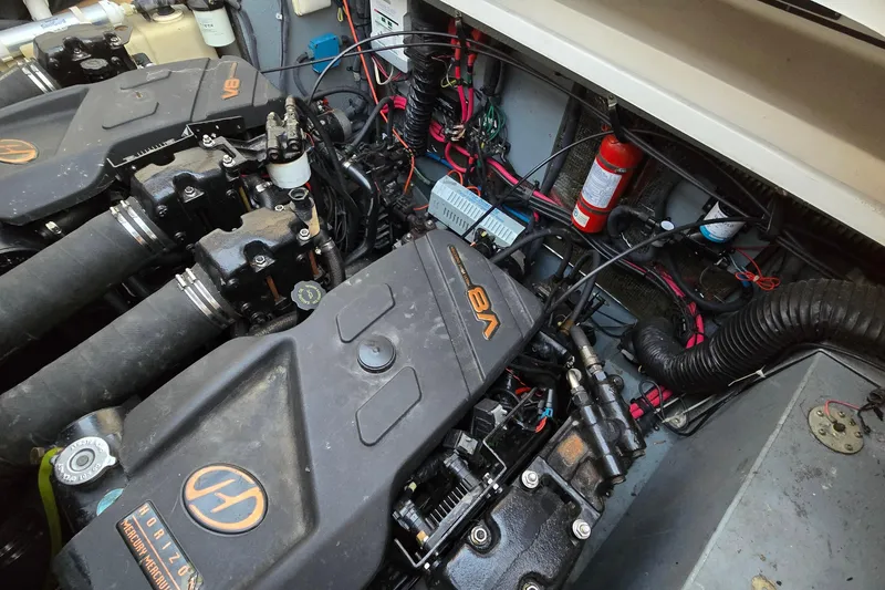 Slide: The Image of Engine compartment of a 2001 Sea Ray 310 Sundancer with V8 Mercury engines. - 86