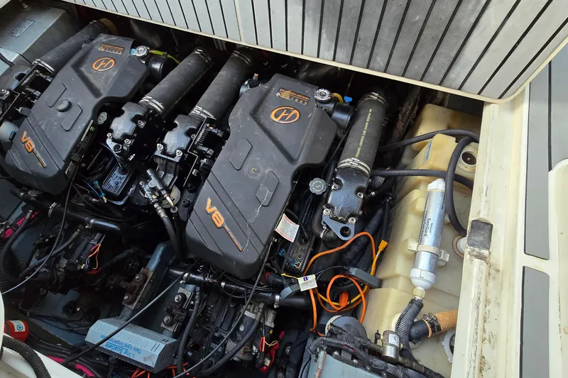 Slide: The Image of Engine compartment of a 2001 Sea Ray 310 Sundancer with dual V8 engines. - 90