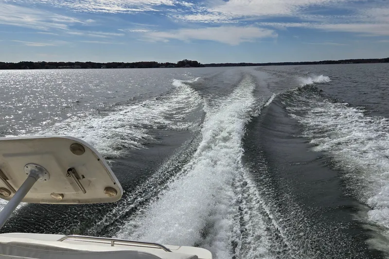Slide: The Image of Wake trail behind 2001 Sea Ray 310 Sundancer on a sunny day. - 94