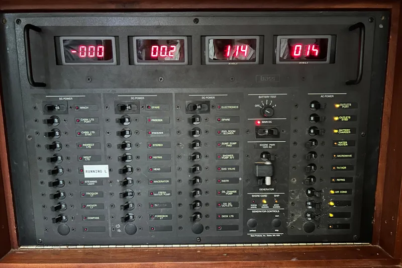 Slide: The Image of Electrical control panel of a 1997 Freedom 45 boat with digital displays and switches. - 15