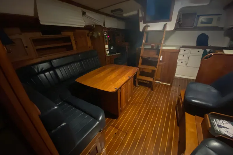 Slide: The Image of Interior of 1997 Freedom 45 yacht with wooden flooring and leather seating. - 16