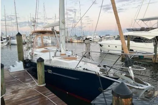 Slide: The Image of Sailboat docked at marina, Freedom 45 model, 1997, with sunset sky. - 4