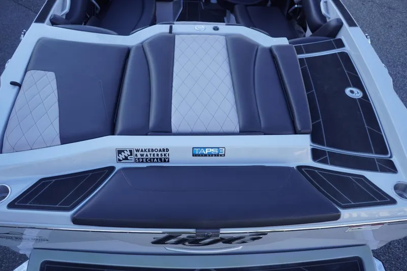 Slide: The Image of 2019 Tigé R20 boat rear seating with TAPS 3 system and wakeboard specialty logo. - 12